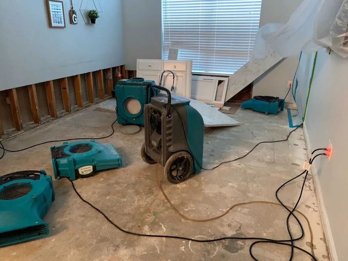 Dehumidifier in flood-cut room for Water Damage Restoration in Bear Creek